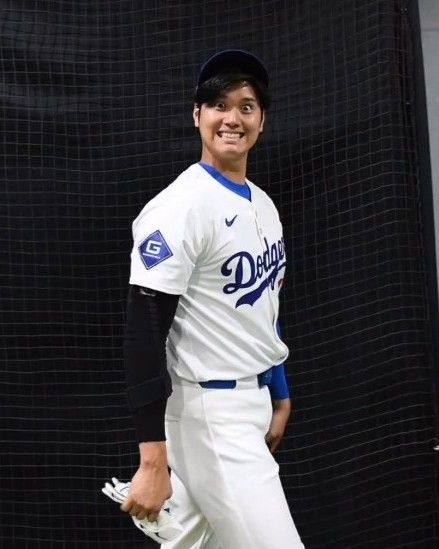 a baseball player is posing for a photo