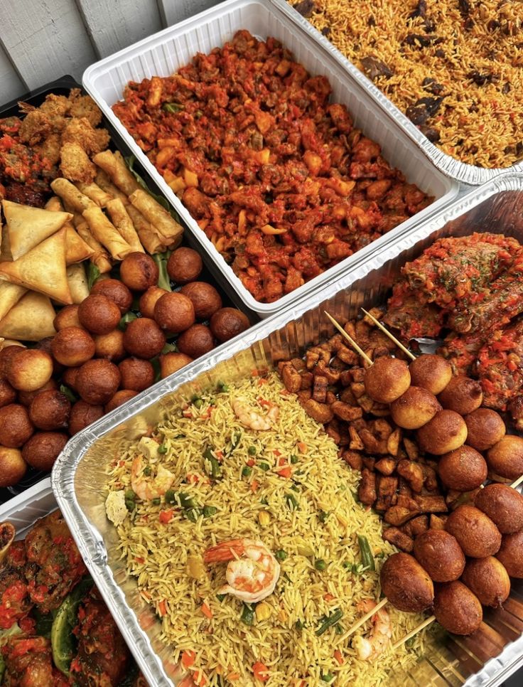 several trays filled with different types of food