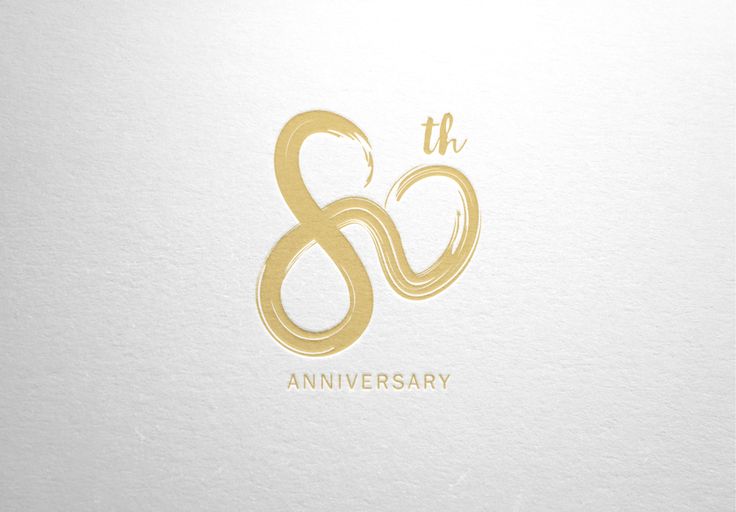 the 8th anniversary logo is shown on a white paper with gold foil and black lettering