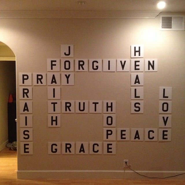 a wall that has some type of words on it in the middle of a room