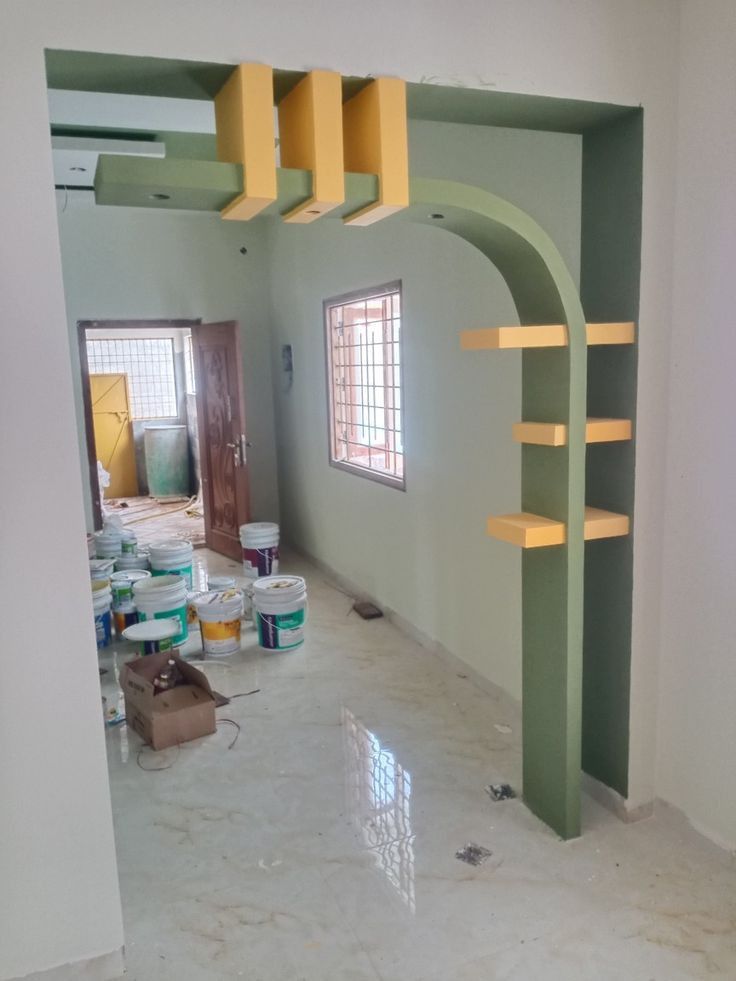 the interior of a house being painted green and yellow