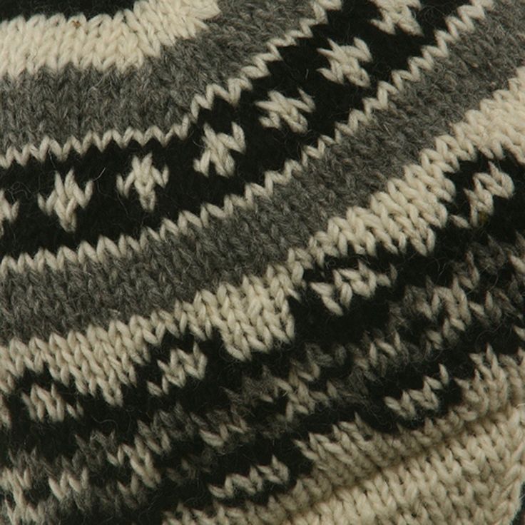 Ring Jacquard Knitting BeanieShell made of 100% wool,Fully lined with soft fleece.10 inches wide, 8 inches deep crown.Hand washable.ONE SIZE fits most, from child to adult.Available in Off White, Black, Grey, Sage and .Made in Nepal. This chunky wool beanie with subtle earflaps and distinctive Himalayan style will keep you well insulated from the cold of winter. Constructed out of 1 panel of thick, medium weave knit, for a stretchy fit, the hat is fully lined in a soft fleece fabric, for added i Casual Black Winter Patterns, Comfortable Knitted Patterns For Winter, Cozy Knit Patterns For Winter, Cozy Winter Knit Patterns, Cozy Knitted Winter Patterns, Winter Knitting Pattern For One Size Fits Most, Winter Beanie Patterns, One Size Fits Most, Nordic Knit Patterns For Winter, Winter Knitting Patterns With Acrylic Yarn