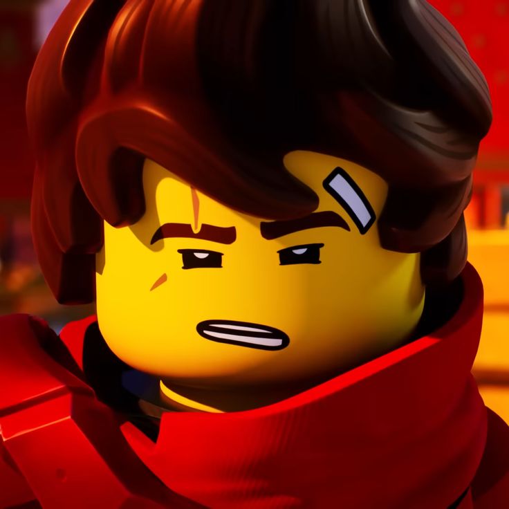 the lego movie character is wearing a red scarf and looking at something in front of him