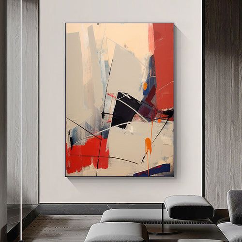 an abstract painting hangs on the wall in a living room