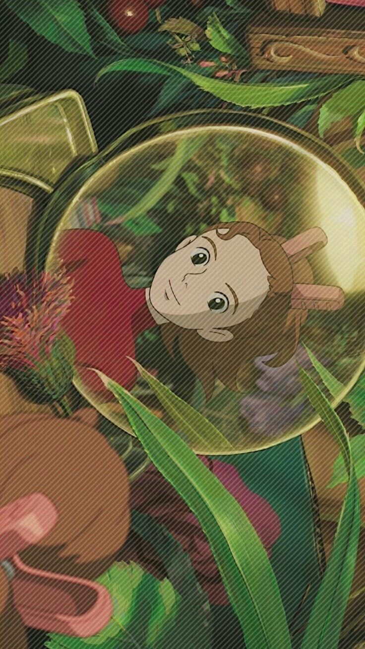 the monkey in the mirror is surrounded by plants