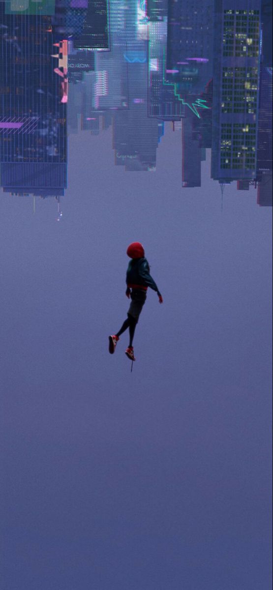 a man is flying through the air in front of a cityscape with skyscrapers