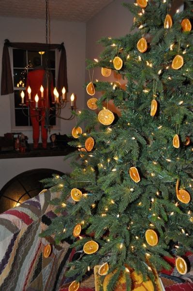 a small christmas tree with oranges on it