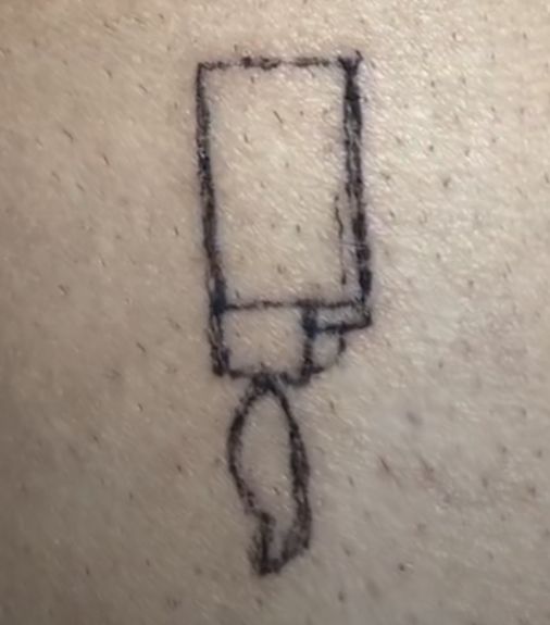 a drawing on the back of a person's shoulder with a camera attached to it