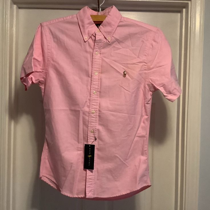 Ralph Lauren Oxford Shirt Nwt Color= Pink Size= Small Classic Oxford Casual Button Down Short Sleeve 100% Cotton Was Purchased At Macys, Cannot Return Comes From A Nonsmoking Home Make An Offer Inventory 101 Ralph Lauren Pink Summer Shirt, Casual Pink Ralph Lauren Shirt, Casual Ralph Lauren Button-up Top, Ralph Lauren Preppy Button-up Shirt, Pink Button-up Shirt With Placket, Ralph Lauren Shirt, Oxford Shirt, Button Downs, Kids Shirts