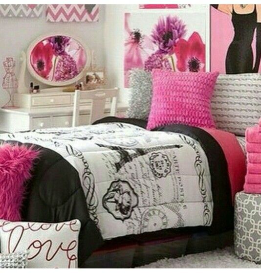 a bedroom decorated in pink, black and white