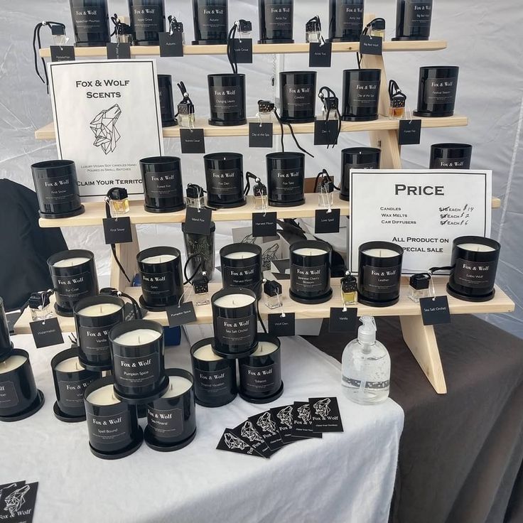 many black candles are on display for sale