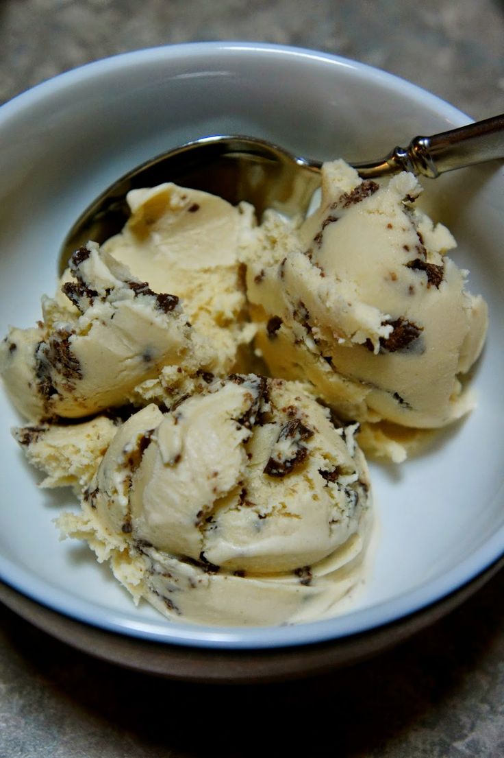 three scoops of ice cream in a white bowl