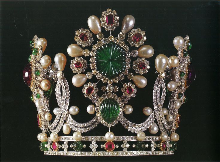 a tiara with pearls and jewels on it