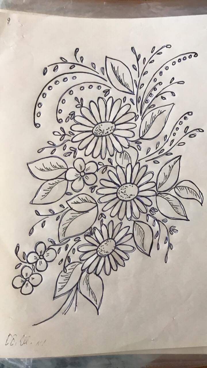 a drawing of flowers and leaves on paper