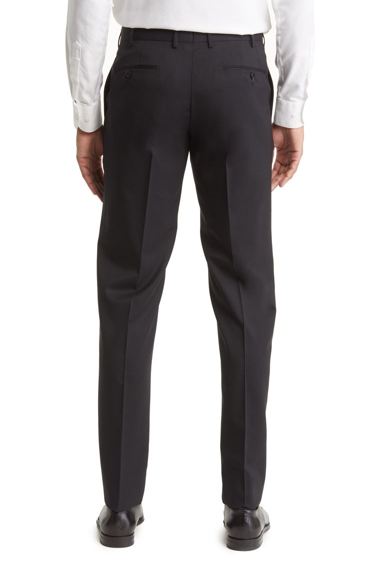 Polished Italian wool with a touch of stretch smartly finishes a pair of trousers tailored with a flat front and signature flexible construction in the waist. 37" inseam; 15" leg opening; 10" front rise; 15 1/2" back rise (size 35) Lined to knee 98% wool, 2% elastane Dry clean Made in Italy Tailored Semi-formal Bottoms In Suiting Fabric, Workwear Straight Suit Pants, Wool Flat Front Bottoms For Workwear, Flat Front Bottoms With Welt Pockets In Suiting Fabric, Straight Suiting Fabric Pants For Work, Straight Pants In Suiting Fabric For Work, Tailored Black Elastane Dress Pants, Black Tailored Elastane Dress Pants, Tailored Dress Pants With Belt Loops For Office