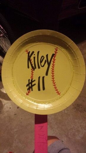 a yellow paper plate with a baseball on it that says riley 11 in black ink