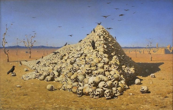 a pile of skulls sitting in the middle of a desert