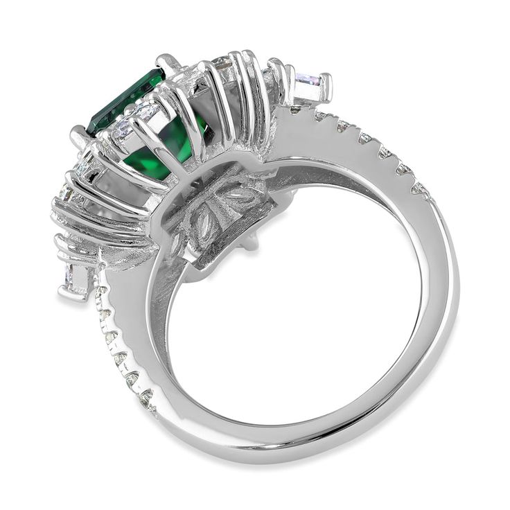 Top of Ring Height: 24.5mm

Top of Ring Width: 22.4mm

Shank Width: 2.4mm


Stone Material: Emerald Cubic Zirconia
Clear Cubic Zirconia

Stone Size: 8.0mmx10.0mm(Emerald)
2.5mm(Princess)
2.0mmx4.0mm(Marquise)
2.5mm(Round)
1.5mm(Round)

Stone shape: Emerald
Princess
Marquise
Round

Stone Carat Weight: 3.79 ct.
0.1 ct.
0.1 ct.
0.06 ct.
0.015 ct.

Total Number of Stones: 77

Stone Setting: Prong


Metal: 925 Sterling Silver

Plating: Rhodium

Finish: High Polish Halo Ring With Prong Setting In Cubic Zirconia, Crystal Ring With Diamond Center Stone For May Birthstone, May Birthstone Crystal Ring With Diamond Center Stone, Dazzling Emerald Ring With Halo Setting For Promise, Cubic Zirconia Emerald Ring With Halo Setting, Emerald Rings With Diamond White Halo Setting, White Gold Emerald Ring With Cubic Zirconia Accents, Silver Emerald Ring With Cubic Zirconia Center Stone, Silver Emerald Ring With Cubic Zirconia