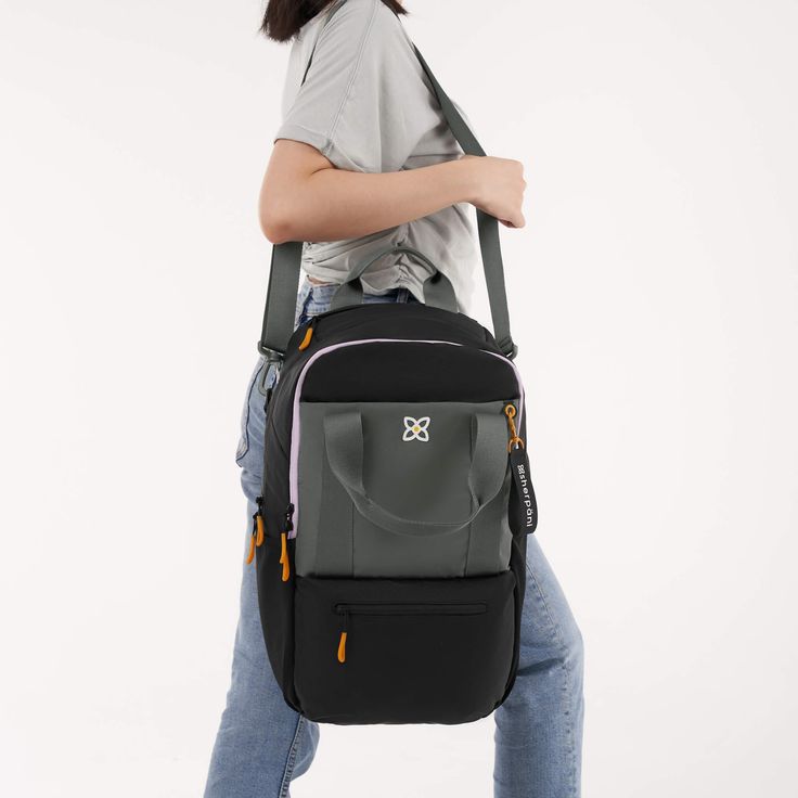 A Sherpani best-seller, our newly updated Camden backpack now has even more to love! This backpack is made for all-day adventures with a large capacity to handle those “just in case” items. Made from recycled material, the Camden features three water bottle holders, a padded laptop sleeve and a luggage pass through. The perfect personal item for air travel, the Camden is sure to be your new travel favorite! Mini Laptop, Suitcase Handle, Packing Luggage, Convertible Backpack, Convertible Bags, Water Bottle Holders, Air Travel, Classic Backpack, Satchel Purse