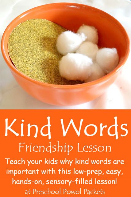 an orange bowl filled with cotton floss on top of a white counter next to a sign