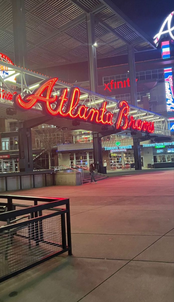 the atlanta braves sign is lit up at night