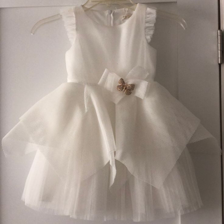 Perfect For Baptism Or Flower Girls. White Tulle And Flutter Detail On Sleeves. Butterfly Brooch On Waist. Spring Baptism Tutu Dress With Bow, Spring Baptism Princess Dress With Bow, Spring Princess Dress With Bow For Baptism, Ruffled Tutu Dress For First Communion, Spring First Communion Dress With Bow, White Tulle First Communion Dress With Ruffles, Summer Baptism Tutu Dress With Bow, Fitted Tutu Dress With Bow For Baptism, Summer Tutu Dress With Bow For Baptism