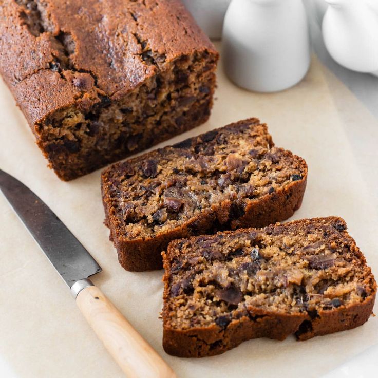 three slices of banana bread on a cutting board