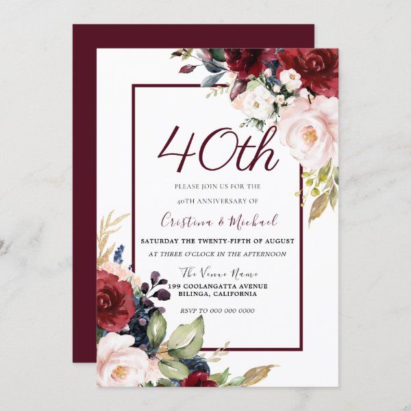 the burgundy and white floral wedding card is displayed on a marble surface