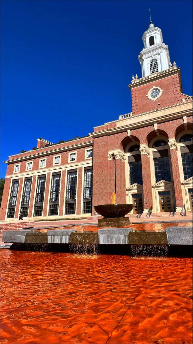 the building has a fountain in front of it