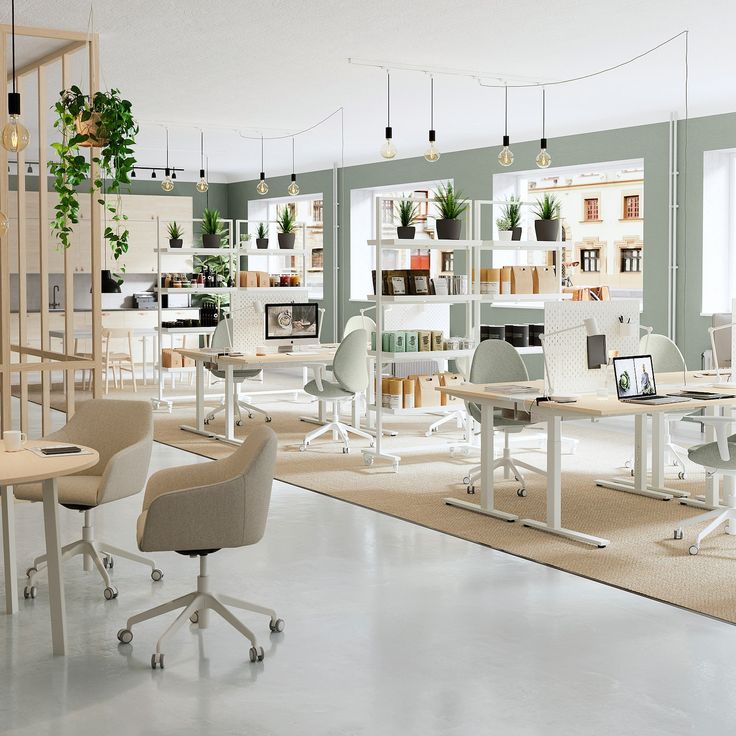 an office filled with desks and chairs next to shelves full of bookshelves