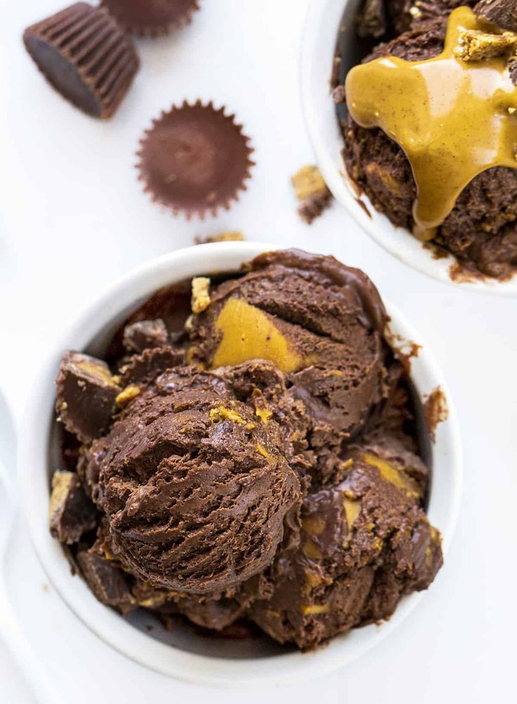 two white bowls filled with chocolate ice cream and peanut butter on top of each other