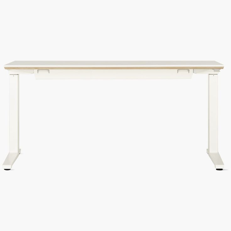 a white desk sitting on top of a wooden table