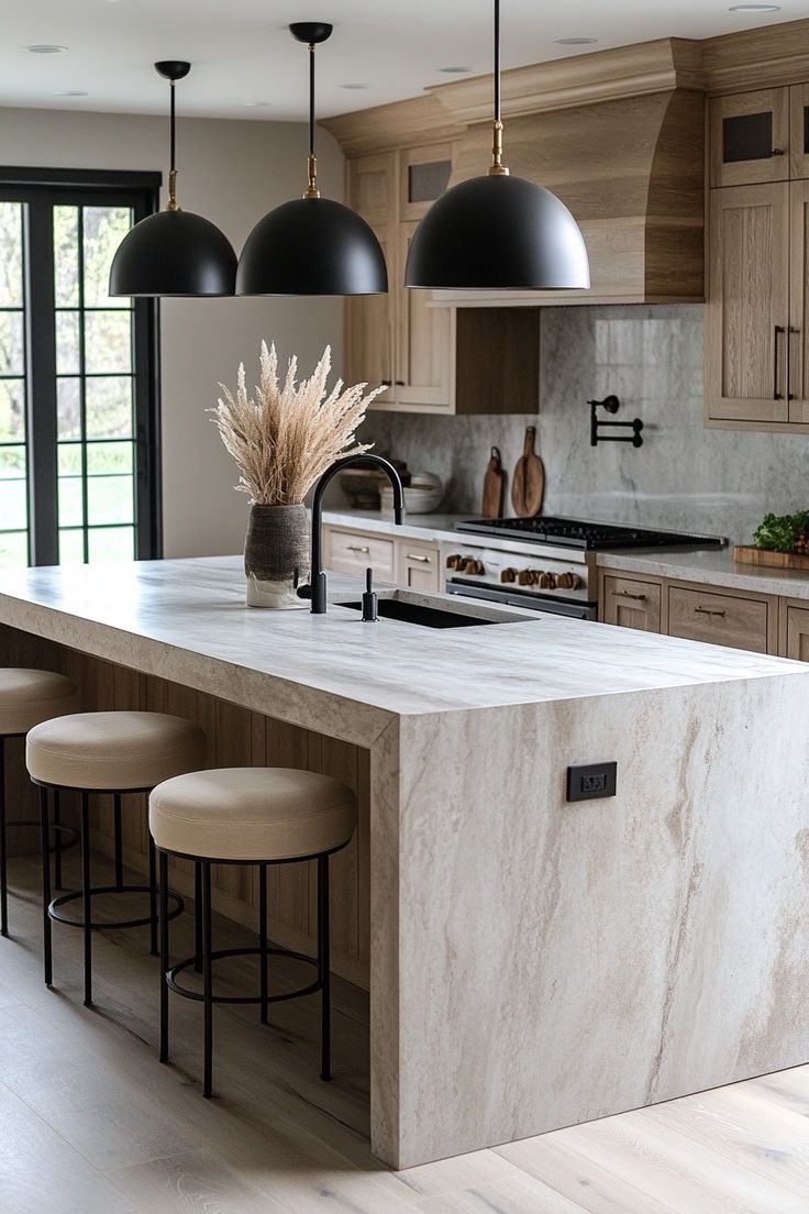 a kitchen with marble counter tops and stools next to an island in the middle