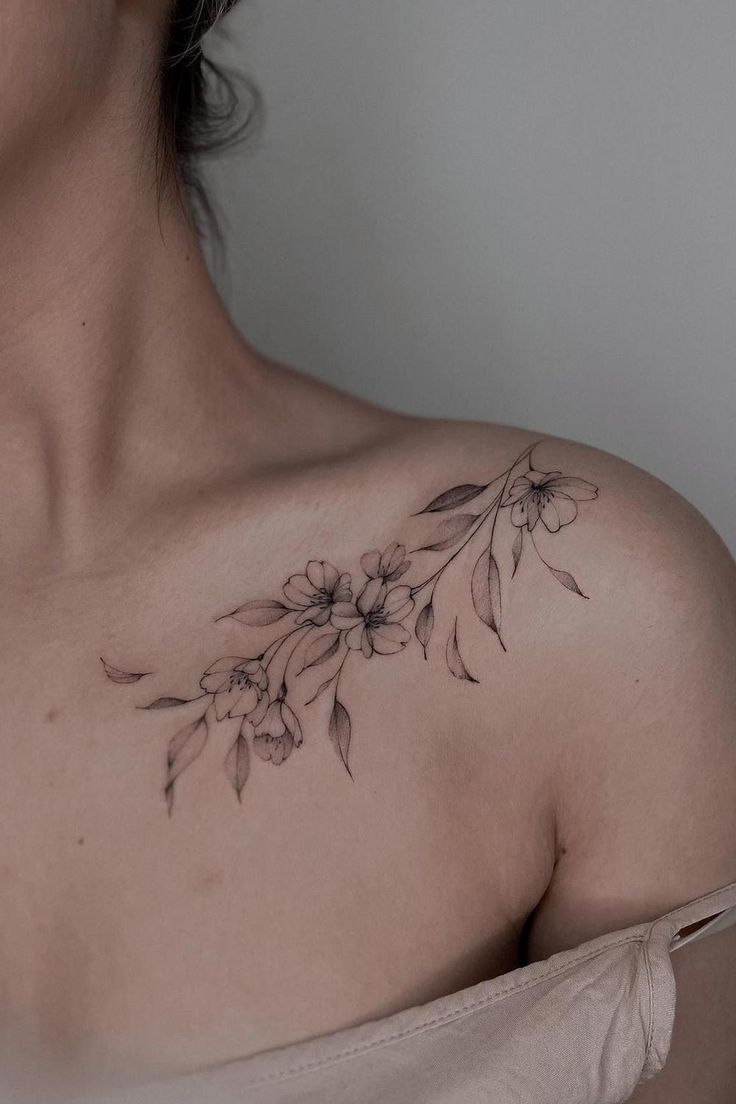 a woman's chest with flowers on it