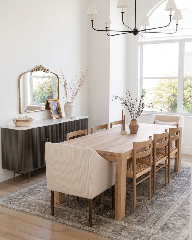 the dining room table is surrounded by chairs