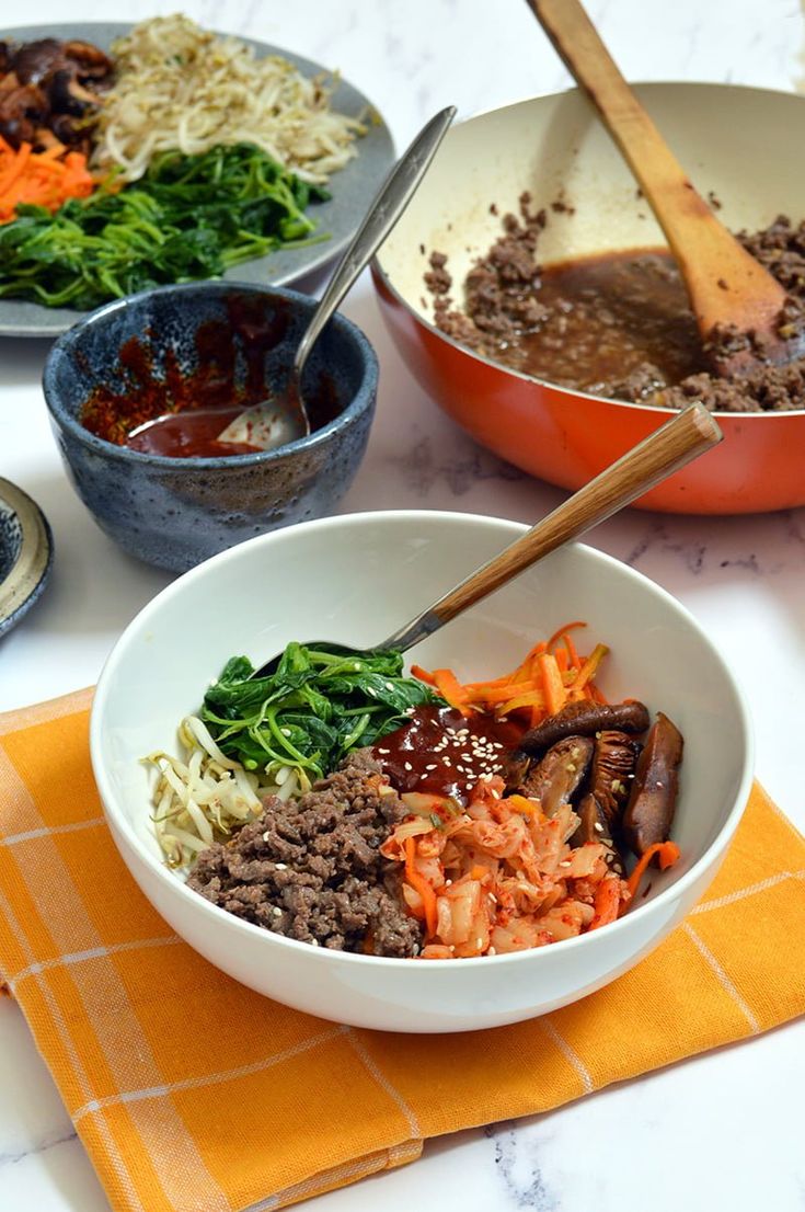 two bowls filled with different types of food