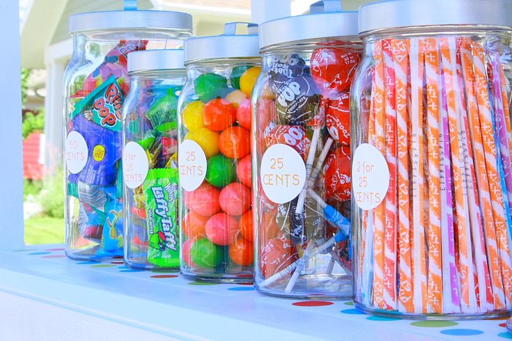 there are many different types of candy in the jars