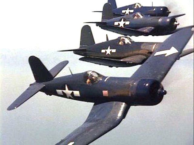 four fighter jets flying in formation with one on the front and one on the back