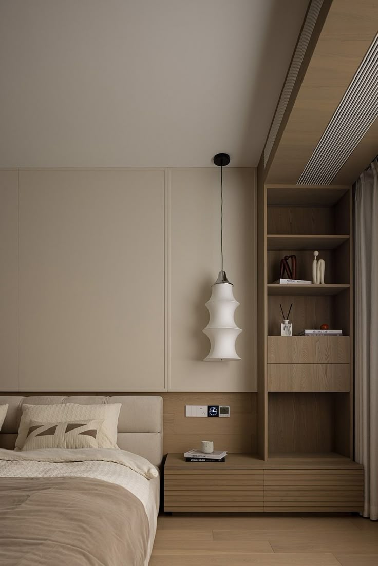 a bed sitting in a bedroom next to a wooden shelf filled with books and other items