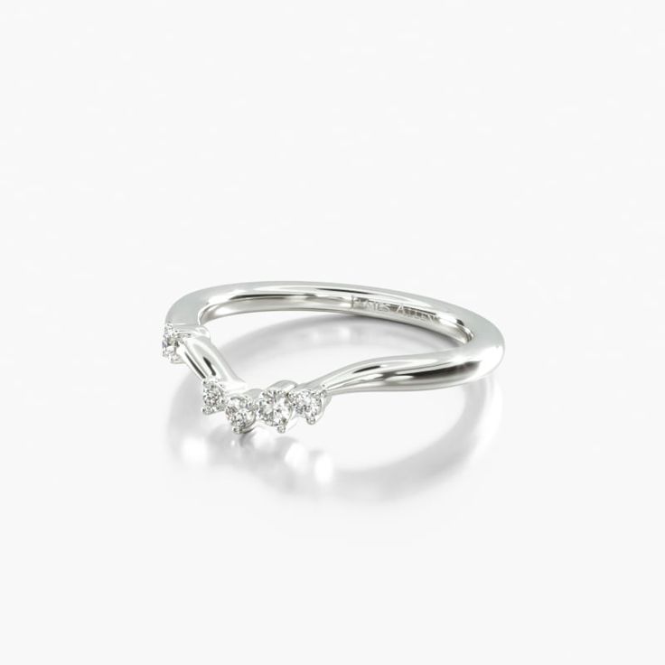 a white gold ring with three diamonds