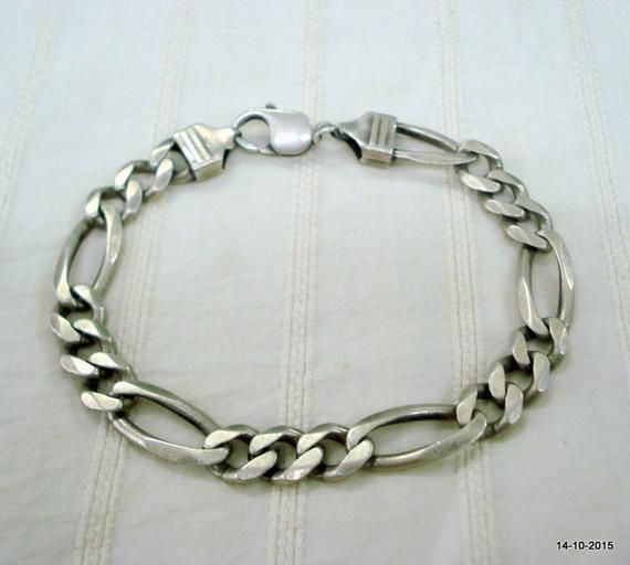 VINTAGE ANTIQUE TRIBAL OLD SILVER LINK CHAIN BRACELET FROM RAJASTHAN INDIA, GREAT HANDMADE DESIGN GOOD FOR JEWELLERY COLLECTION.Length - 22.7 cm(8.93") we can adjust the length.width - 10 mmweight - 25.5 gramsmaterial - Silver & original old worn piece. Festive Oxidized Sterling Silver Bracelet, Handmade Metal Chain Bracelet For Wedding, Antique Silver Hallmarked Metal Bracelets, Sterling Silver Bracelet With Oxidized Finish For Festivals, Antique Finish Silver Metal Bracelets, Bohemian Silver Chain Metal Bracelet, Silver Metal Bracelets With Antique Finish, Silver Metal Bracelet With Antique Finish, Handmade Silver Bohemian Chain Bracelet