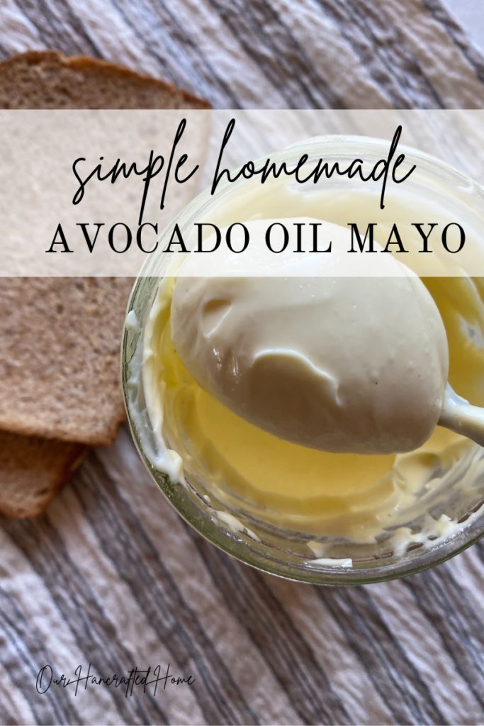 an image of homemade mayonnaise in a glass bowl with bread on the side