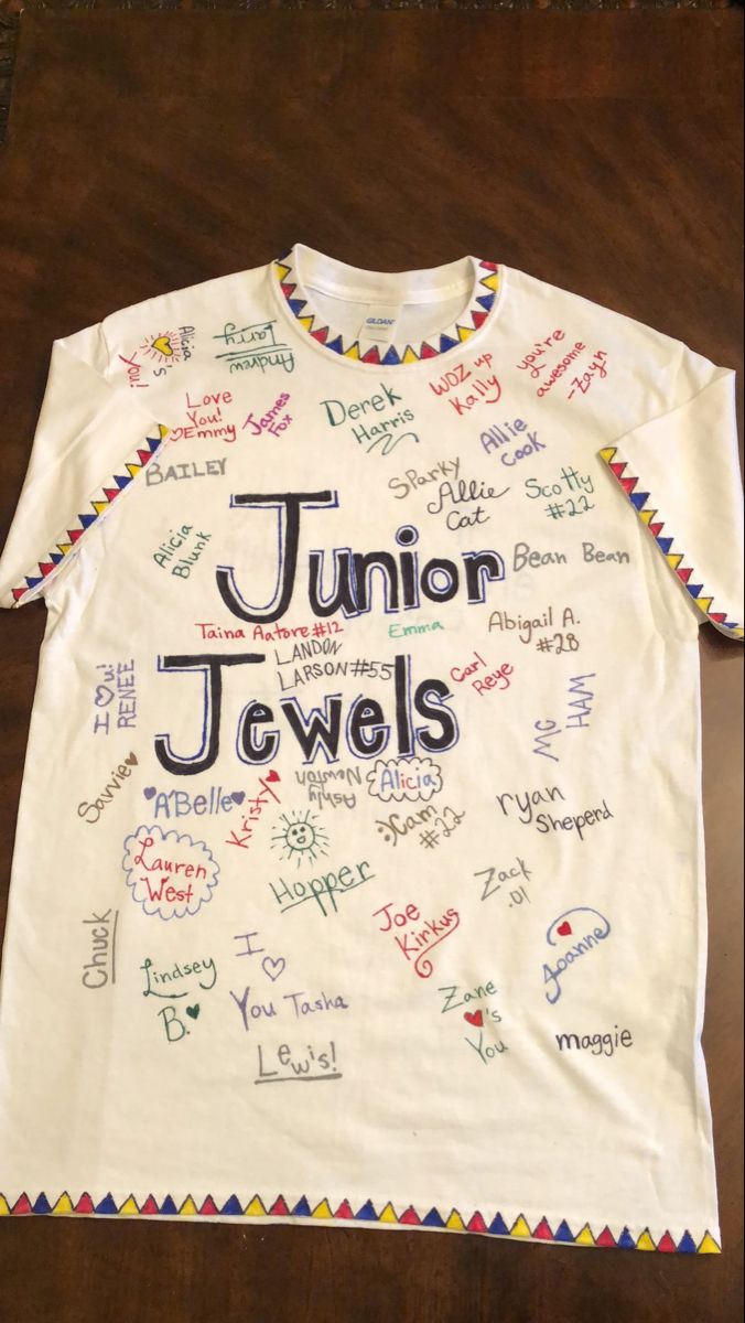 a white t - shirt with the words junior jewels written in different languages on it