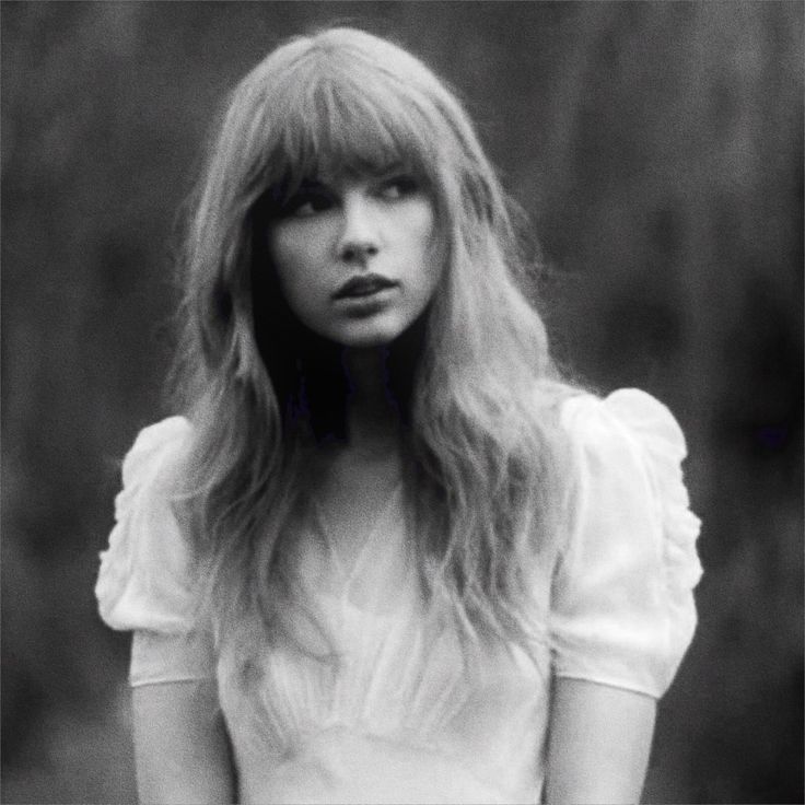 a black and white photo of a woman with long hair