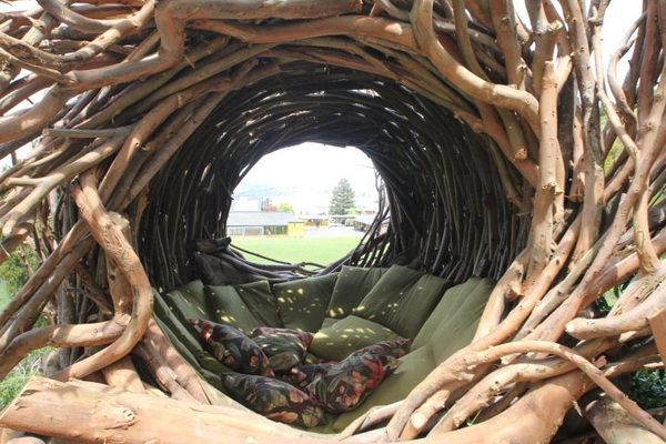 the inside of a wooden structure made out of branches