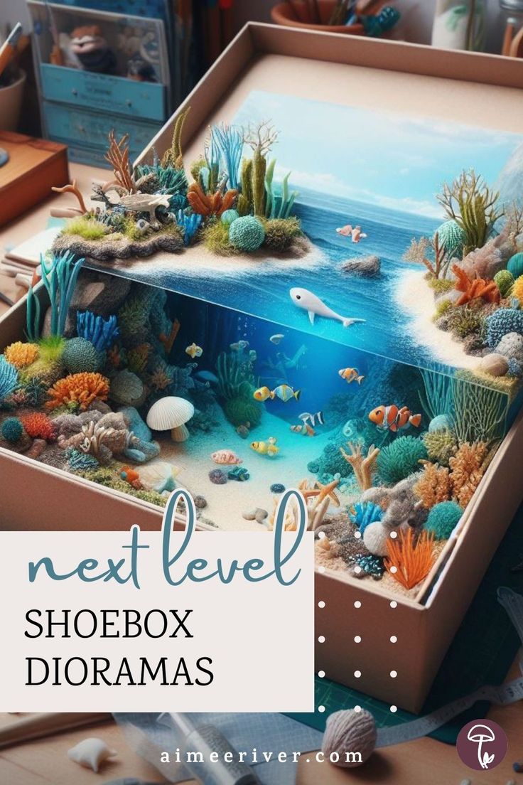 Shoebox diorama mini craft with an oceanic scene combining an underwater view and coastal scenery Shoe Box Diorama Ocean, Mountain Diorama Shoebox School Projects, Diorama Shoebox Ideas, Lake Diorama Project, Ocean Box Project, Diorama Box Ideas, Ocean Diaroma Ideas, Shoebox Diorama School Projects, Ocean Biome Shoebox Project