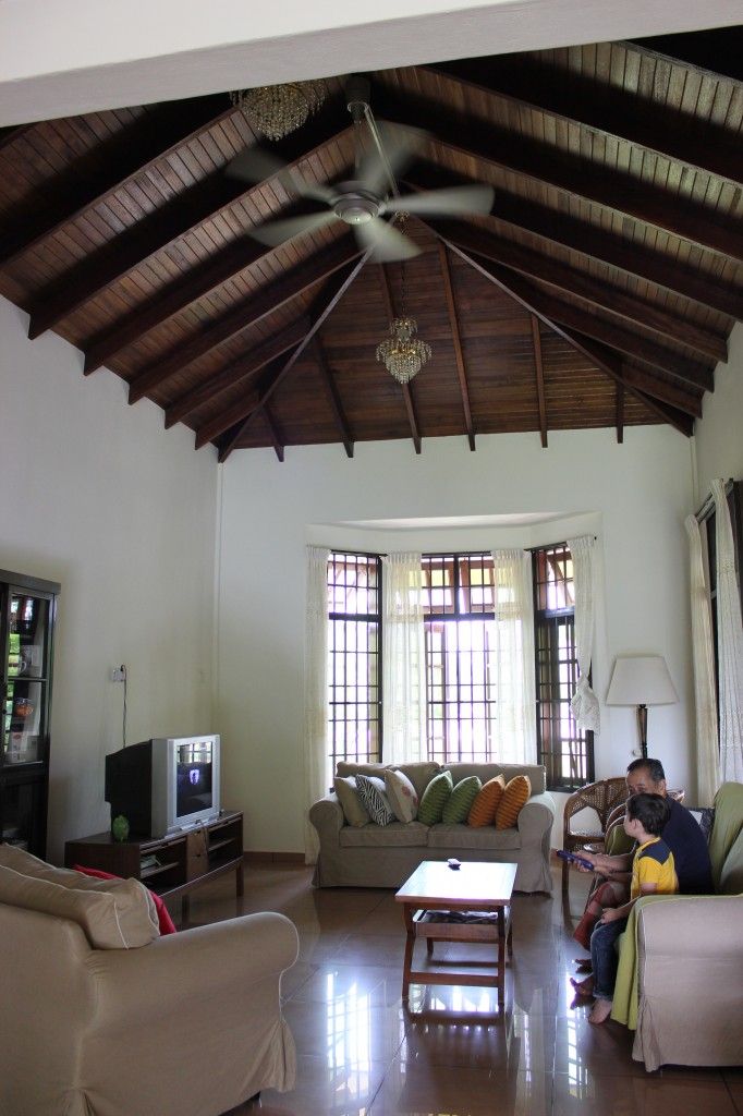 a man sitting on a couch in a living room