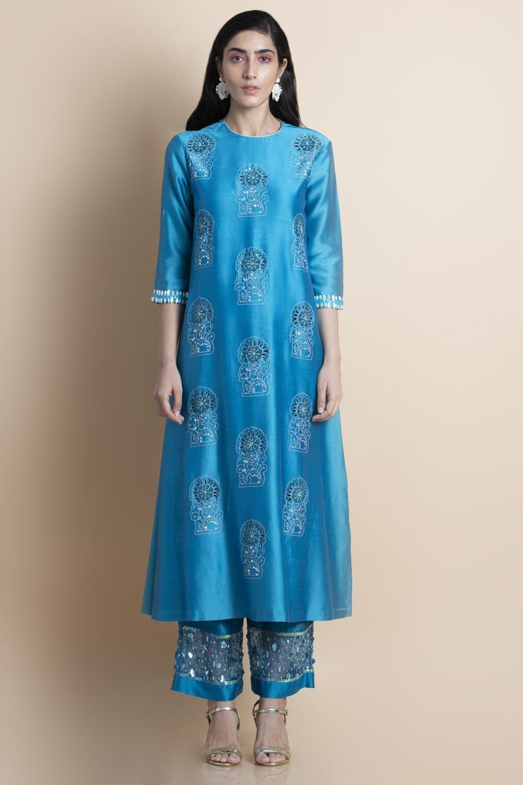 Editor's Note Featuring a skydive blue embroidered kurta in chanderi comes with matching parallel pants in chanderi with organza panel featuring tonal hand embroidery. Color: Blue Fabric: Chanderi Care: Dry Clean Only Customize Your OutfitCan't find the size you're looking for? No stress. Just select the size "Custom" while adding the item to your cart. We will follow up with you for your body measurements. To request a color or design customizations, please contact our customer care by using ou Parallel Pants, Embellished Pants, Kurta Set For Women, Cotton Kurti Designs, A Line Kurta, Embroidered Neckline, Kurta Set, Kurti Designs, Set For Women