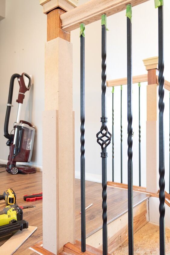 an image of a stair railing being installed on the floor in a house under construction