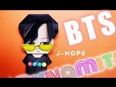 an origami paper doll with sunglasses on it's head and the words bts above it